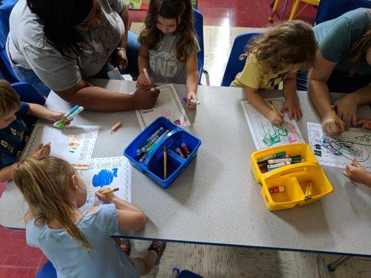 Pre-k working on an All About Me project