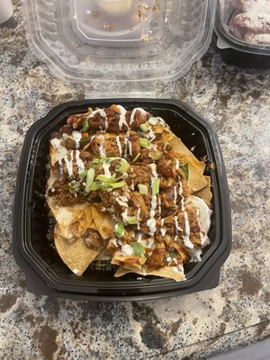 Chicken nachos were good and worth the $12.95 but BBQ sauce is sweet.