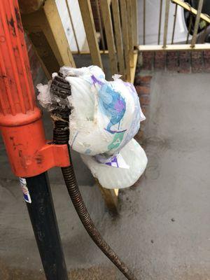 Customer called in a clogged toilet. This is what we pulled out. A diaper.