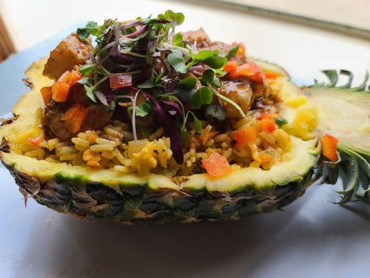 BBQ Shrimp Pineapple Bowl" New Orleans BBQ Shrimp with an Asian inspired twist over Creole Fried Rice with Crawfish stuffed in a Pineapple B