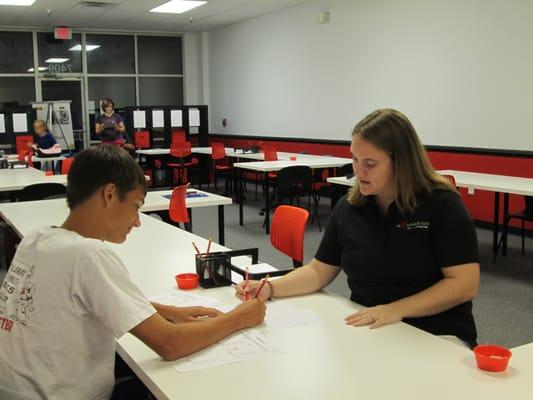 Center Director, Jennifer Cordileone, working with a High School student