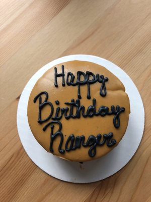 Peanut butter cake. Ignore the dent and smudge. It shifted in my car driving home and hit the side.