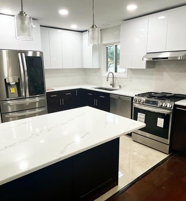 We install kitchen cabinets and all paint and tile work.