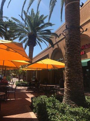 You can get your coffee and enjoy it by the fountain under the shade of the palm trees and umbrellas! Such a nice place!