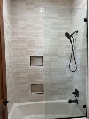 Riad "White" ceramic wall tile works great as shower or bath surround.