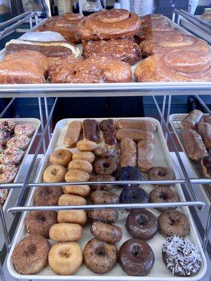 Bear claws, apple fritters, cinnamon rolls, custard filled bars, lemon jelly, and various classic cake donuts.