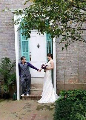 Wedding photos in front of one of the side doors.