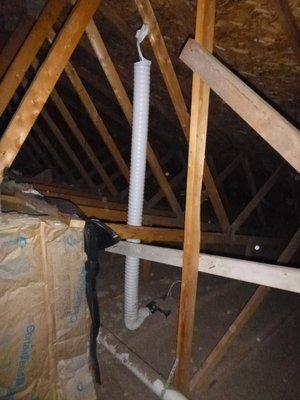 Improperly installed wall insulation and bath exhaust vent terminating in the attic.