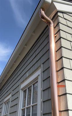 Now installing fiberglass gutters . Copper downspout's are very classy look!