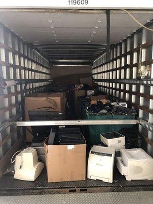 A whole truck full of old unwanted equipment.