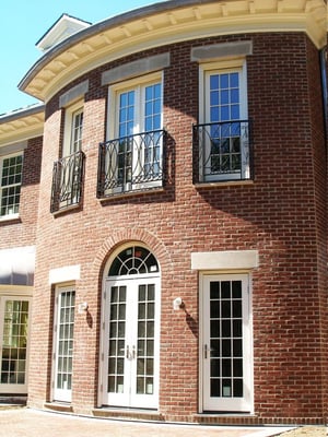 Custom curved balcony handrails to match the curvature of the building.