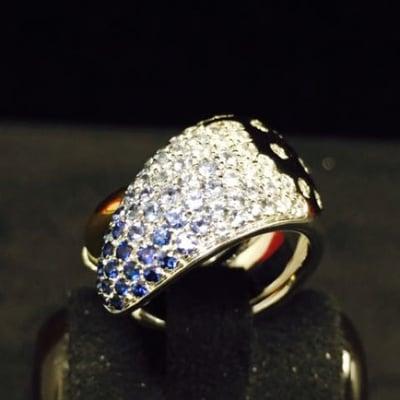 This is a exclusive sapphires and diamonds 18k gold ring only at Carranza Jewelers