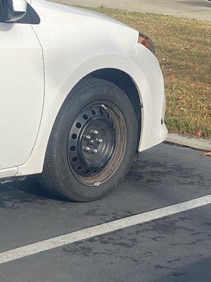 Missing hubcap.  I thought it was a spare tire.