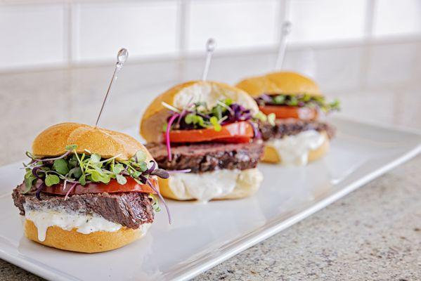 Beef tenderloin slides with horseradish mayo, tomatoes & microgreens