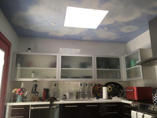 This is the kitchen ceiling mural that was based out by Terry Hunt Painting and Decorating, so I could hand paint all the various clouds.