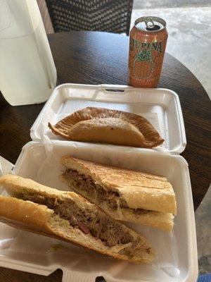 Mojo Pork sandwich, chicken empanada, and Jupiña pineapple soda.