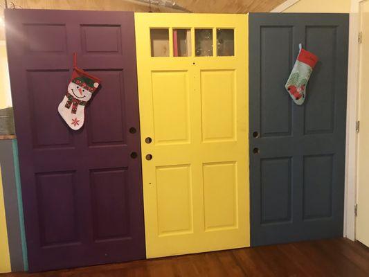 Cute colorful doors making up a partition to their kitchen