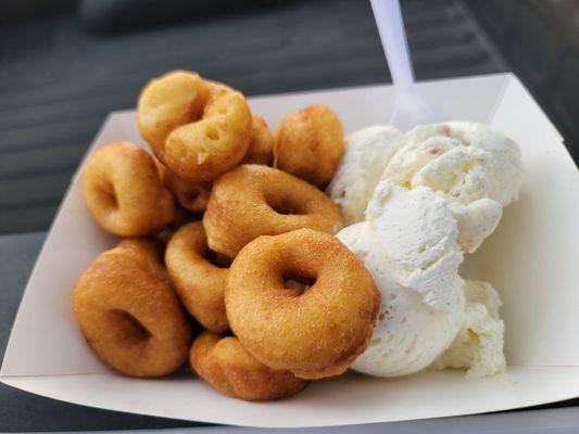 Dozen plain doughnuts with a scoop of vanilla ice cream