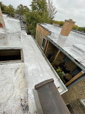 Gutters replaced in one of the properties along with chimney work on roof.