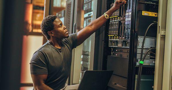 Computer technician working in a server room