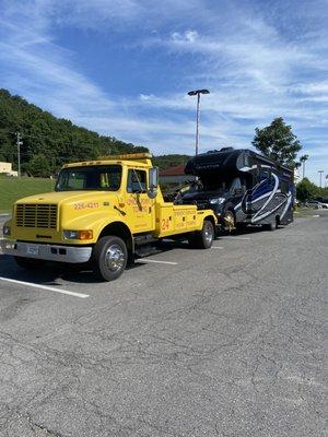 Our Medium Duty Wrecker hauling a 2024 Mercedes Sprinter camper. We are able to take care of all medium duty needs!