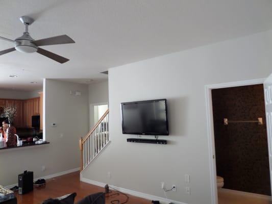 TV and Sound bar, with wire hidden in the wall.