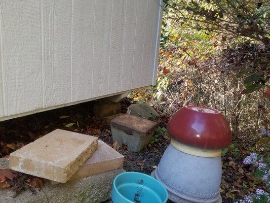 Mose bad use of paving stones and shims to install a shed