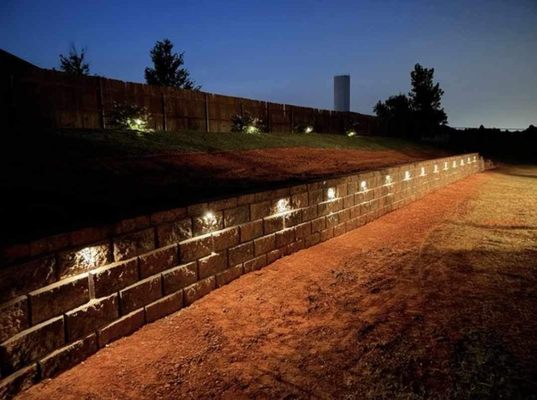 We added lighting to this retaining wall for it's elegance. Functional and aesthetic at the same time.