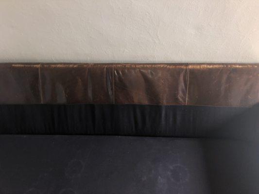 The damage spans 80% of the 96" couch width.