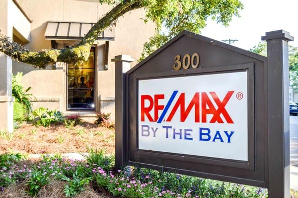 RE/MAX By The Bay - Fairhope Office, 300 Magnolia Ave, at the corner of Magnolia and Church.