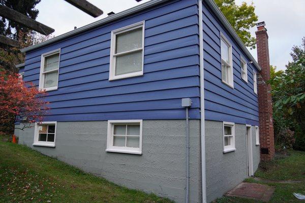 Painting foundation, siding, and trim. We replaced a window sil at ground level that had been rotted away.