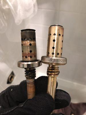 Symmons shower and tub control repair. Showing the broken old spindle versus new one that mixes hot and cold water.