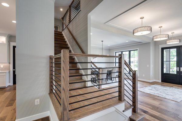 The staircase leads up to the 6 bedrooms available in the home, along with a study space for the kids.