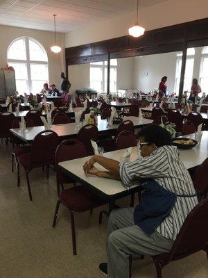 Dining Room prepped for lunch, volunteers all over!