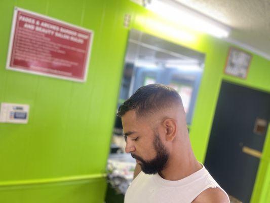 Mid bald Fade haircut done at Fades & Arches Barbershop