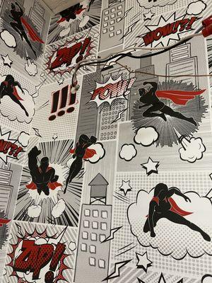 We hung our superhero wallpaper in the bathroom!