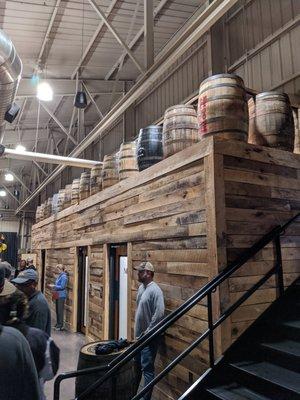 Restrooms, topped by bourbon barrels