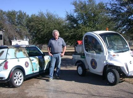 Owner Ken Harris of Bell County Pest Control and their promotional vehicles