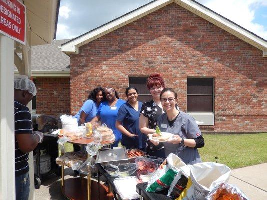 Staff helping at the cookout.