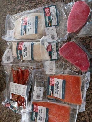 This photo is of our purchases today.   Samon, tuna, halibut and smokes salmon.