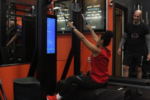 Tara powering through her lat pulldowns, building a strong and defined back with the help of Oxefit Xs1.