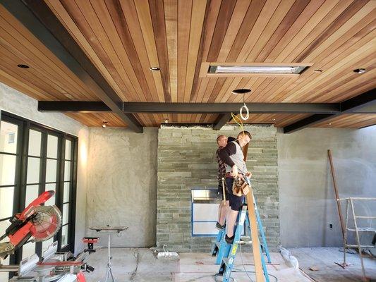 Cedar soffits being installed.