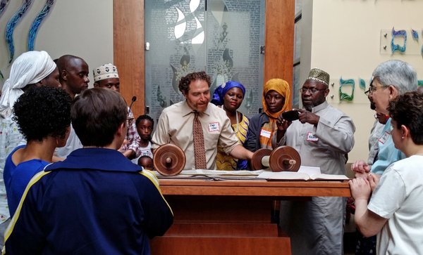 Rabbi Mike showing the Torah to the American Ugandan Muslim Association