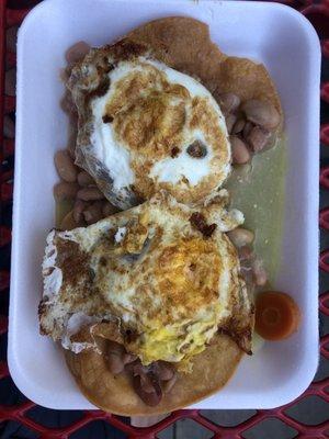 Tostada beans and egg with green salsa