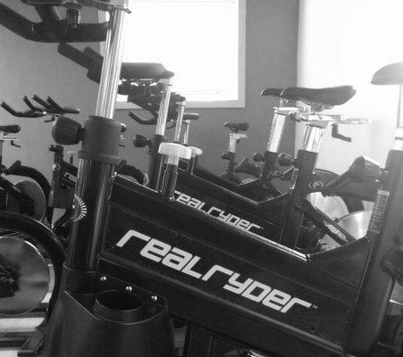 Indoor cycling on RealRyder bikes with a patented articulating frame that gives you a total-body workout while you ride.