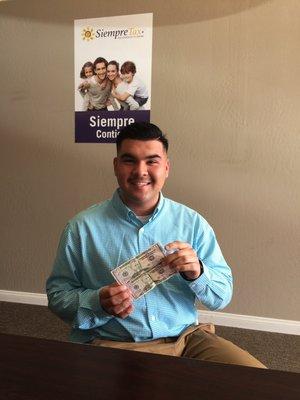 Another client who received two $50 bills for referring two new tax clients.