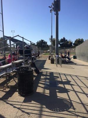 Basic bleachers between fields - but paving and lots more spacious than Twin Creeks means spectators won't come home dusty