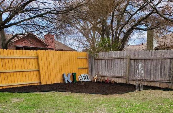 After picture laying tarp in brand new Texas native organic hardwood mulch