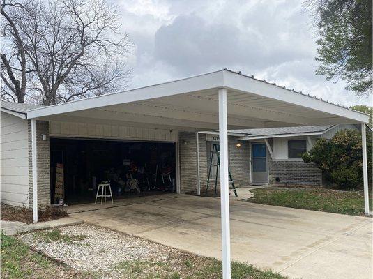 Rusted metal carport sanded, smoothed and repainted with proper paint prolonging life of structure and improving curb appeal.