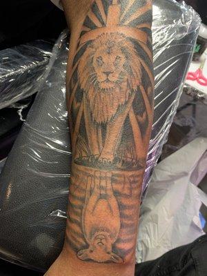 Artist Jewel, Lion an Lamb forearm piece